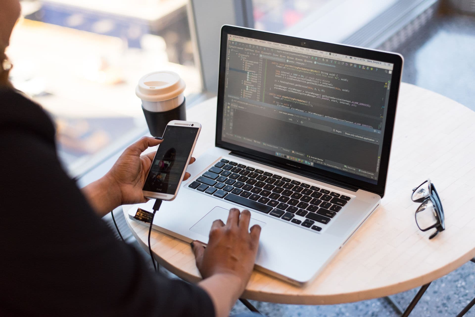 Developers working with code on their laptops